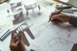 © Chaosamran_Studio - architect design working drawing sketch plans blueprints and making architectural construction model in architect studio