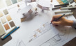 © Chaosamran_Studio - architect design working drawing sketch plans blueprints and making architectural construction model in architect studio