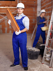 Portrait of two confident workers