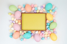 Happy Easter Card. Frame With Assorted Sizes Pastel Easter Eggs With Copy Space For Text. Flat Lay On White Background