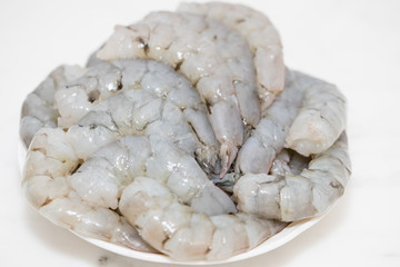 Frozen Fresh Shrimp on a white plate, on white background - Image