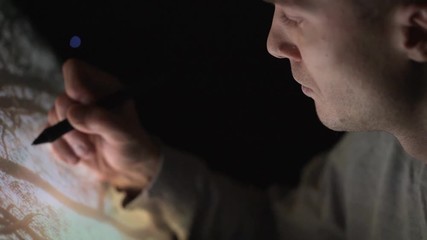 Wall Mural - professional creative digital artist photographer editing his artwork on interactive tablet computer