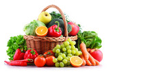 Fresh Organic Fruits And Vegetables In Wicker Basket