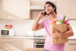 © Elnur - Young handsome man with vegetables in the kitchen