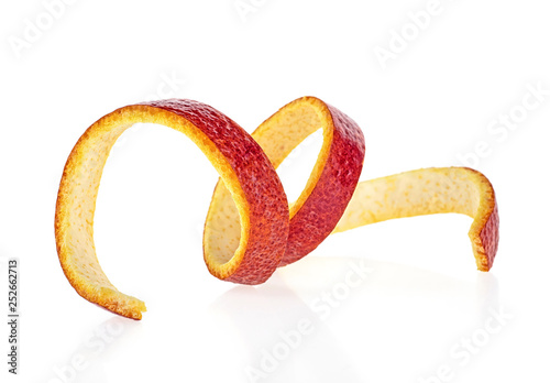 Cuadros en Lienzo Sicilian orange peel on a white background. Orange zest spiral.