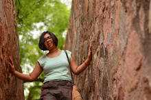 Young Indian Woman With Short Hair Wearing Specs Climbing Down Stairs In A Heritage Castle