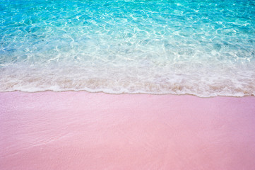 Soft blue ocean wave on pink sandy beach summer concept
