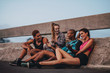 © Jacob Lund - Fitness group resting after workout
