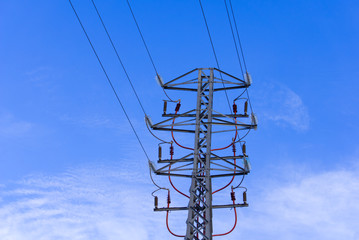 high voltage tower with blue sky background