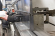 © zilber42 - operator bending metal sheet by sheet bending machine