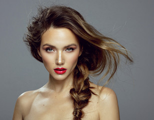 Attractive young girl with red lips and messy hair