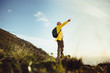 © Jacob Lund - Hiker enjoying the view standing on a hill