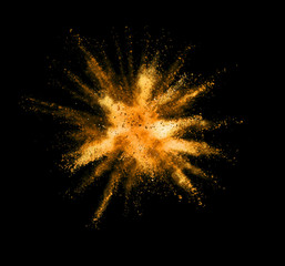 Wall Mural - Explosion of golden powder on black background