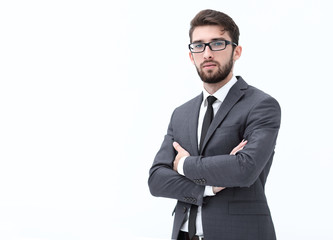 Casual young businessman standing arms crossed, smiling