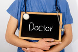 Fototapeta  - Doctor shows information on blackboard: doctor.  Medical concept.