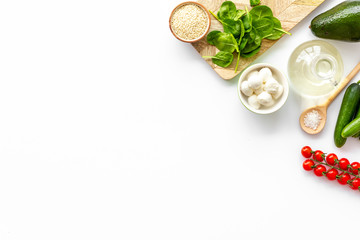 Wall Mural - Ingredients for fresh vegetable salad on white kitchen desk top view space for text