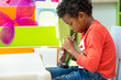 © weedezign - Black American kid play with color pencil alone at classroom in kindergarten preschool,Education concept.