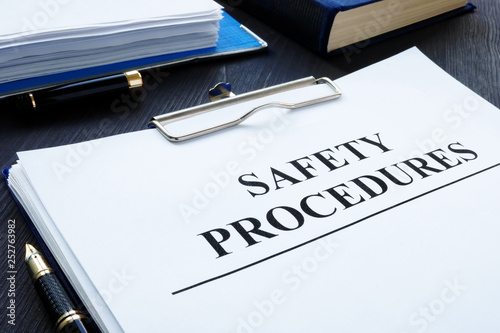 Vászonkép  Workplace health and safety Procedures with clipboard.