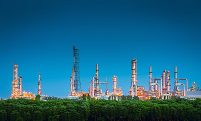 Landscape of Oil and Gas Refinery Manufacturing Plant., Petrochemical or Chemical Distillation Process Buildings., Factory of Power and Energy Industrial at Twilight Sunset., Engineering Petroleum.