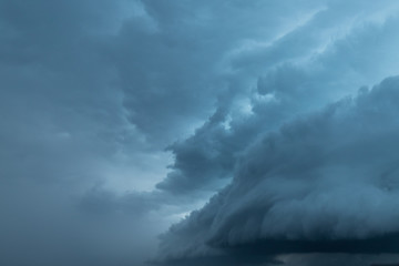 Wall Mural - Texture of storm clouds on dark sky.