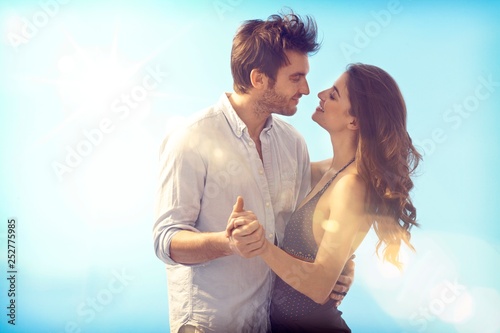 Loving couple kissing at summertime Poster Mural XXL