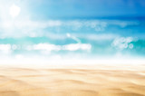 Fototapeta Morze - Blur tropical beach with bokeh sun light wave abstract background.