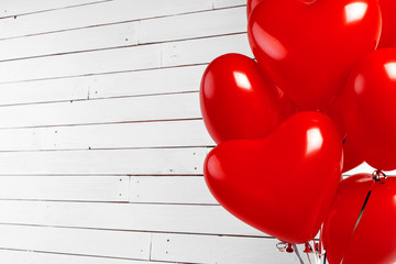 Wall Mural - Air Balloons. Bunch of red heart shaped foil balloons