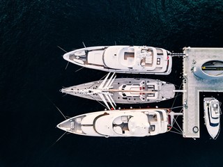 Wall Mural - Aerial view from above at the luxury yachts in the marina