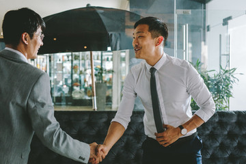 Business people greeting each other with a handshake