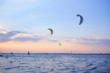 People Swim In The Sea On A Kiteboard Or Kitesurfing