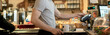 © Mihail - person paying for order with credit card in cafe b