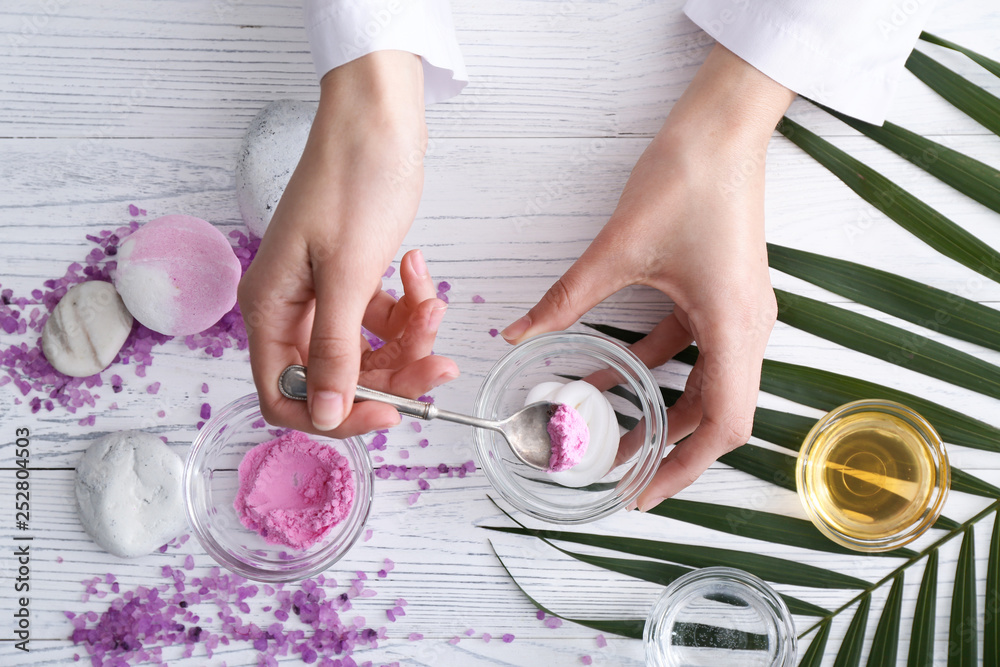 Beautician preparing natural cosmetics, closeup