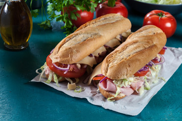 Poster - Submarine sandwiches with ham, cheese and vegetables