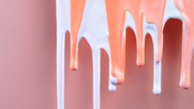 Pink And White Paint Slowly Covering Pink Background. Bright Colored Shot, Party Concept, Detail Abstract Dense Liquid Flowing On Surface