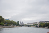 Fototapeta Paryż - historic buildings in paris on the river seine