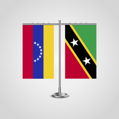 Table stand with flags of Venezuela and Saint Kitts and Nevis. Two flag. Flag pole. Symbolizing the cooperation between the two countries. Table flags