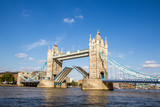 Fototapeta Most - View of Tower Bridge on the River Thames opening for passing boats