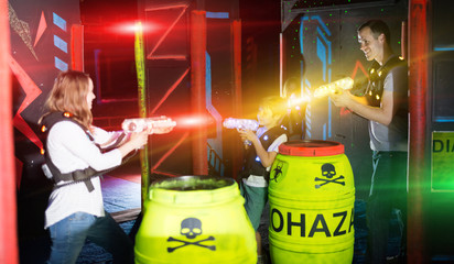 Sticker - Parents and children playing laser tag in beams