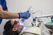 © F8  \ Suport Ukraine - Laser bleaching teeth at dantist room. Teeth whitening for woman. Bleaching of the teeth at dentist clinic. Dental care.