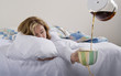 Woman with Hangover Being served Coffee in Bed