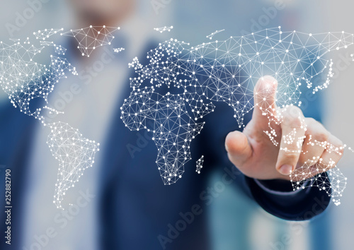 Fotografía Global business and finance concept with businessman touching world map with con