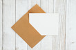 © Karen Roach - Blank envelope with greeting card on weathered whitewash textured wood background
