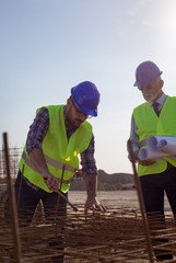 Worker and engineer at building site