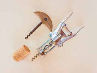 two corkscrews from different eras/two corkscrews from different eras, one in metal and the other in wood and iron