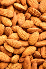 Sticker - Top view of almonds, almond texture background, dry fruits, wallpaper