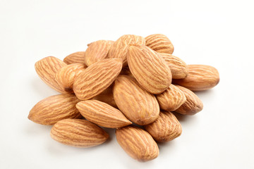 Wall Mural - Closeup of almonds, isolated on the white background.