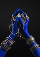 Blue Woman's Hand With Indian Silver Jewelry. Oriental Bracelets On A Hand. Silver Jewelry And Luxury Accessories