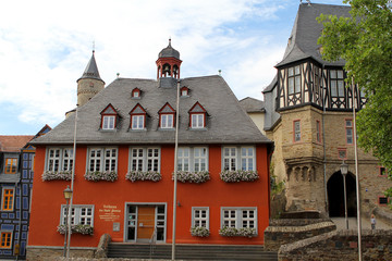 Beautiful building of an elegant red castle of medieval Europe. A small tourist town of Germany in Hesse, 2018