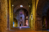 Fototapeta Uliczki - Perugia, Italy - Underground tunnels and chambers of the XVI century Rocca Paolina stone fortress in Perugia historic quarter