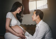 Pregnant women with husband feeling happy